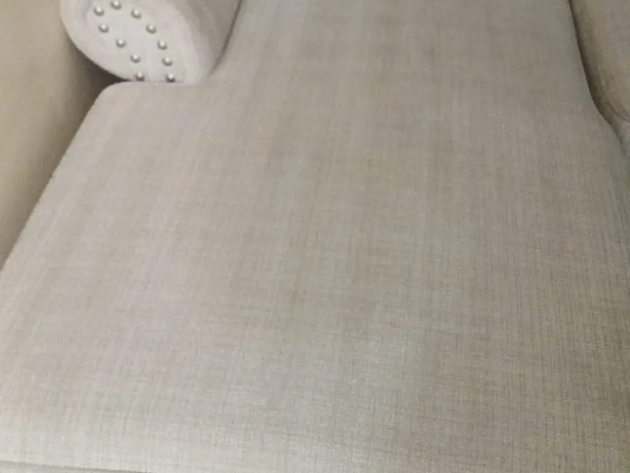 Close-up of the same chaise after cleaning, stains and soil removed