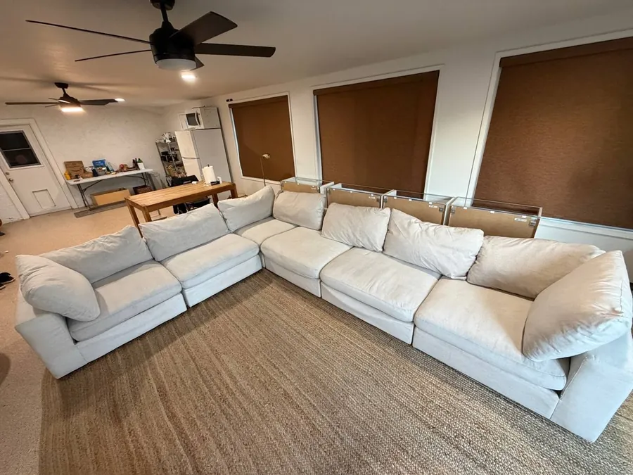 The same cream modular sectional after cleaning, stains and marker removed, fabric even and fresh