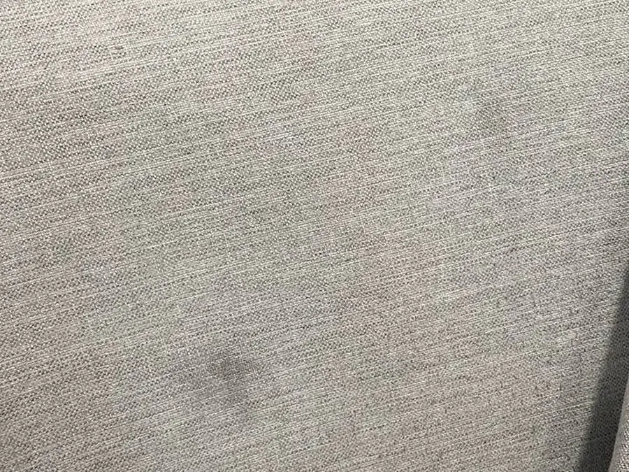 The same gray cushion after ink marker stain removal