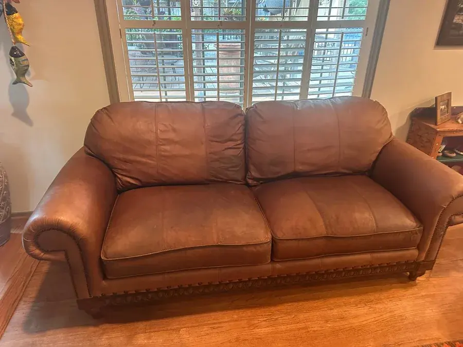 The same brown leather sofa after cleaning and leather restoration