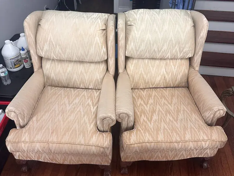 Both wingback armchairs after cleaning, rust stains and water rings removed