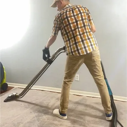 Extracting a carpet with a professional wand in a Houston home
